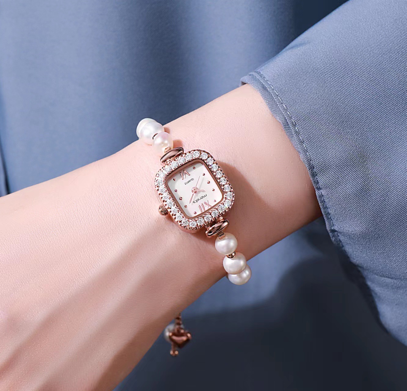 A small watch for a small pearl bracelet, a small waterproof luxurious fashion watch for a lady.