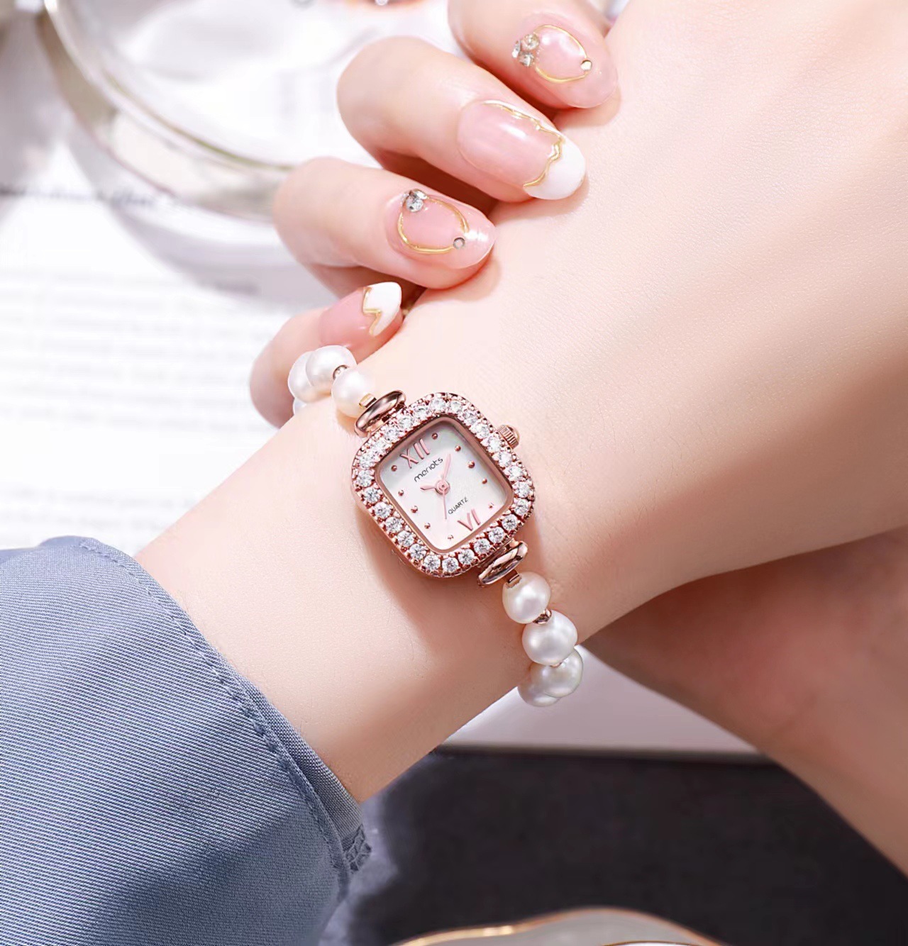 A small watch for a small pearl bracelet, a small waterproof luxurious fashion watch for a lady.